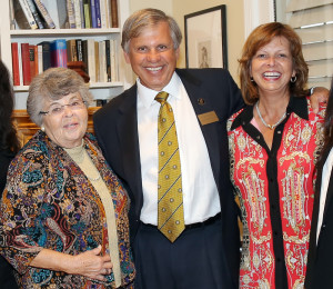 Ruth Revels, left; UNCP Chancellor Robin Cummings, center; and Rebecca Cummings, right.