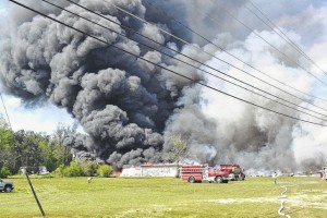 Courtesy photo by Brian Duckworth Heavy smoke from a fire at a former tobacco warehouse in Fairmont was visible from miles away Wednesday afternoon, as firefighters from as many as 15 departments battled the blaze.