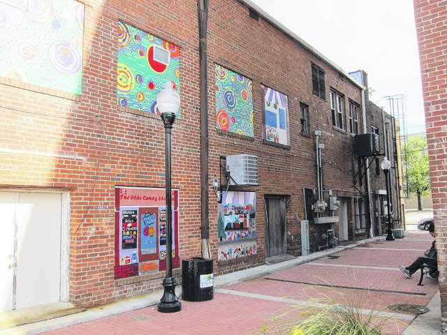 
			
				                                Courtesy photo | Scott Biglow
                                Some Public Schools of Robeson County art students and teachers have loaned their talent to help spruce up an alley in downtown Lumberton. Artworks can now be seen covering some of the old, boarded windows between Elm and Chestnut streets.
 
			
		