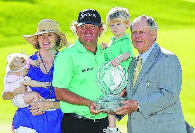 
			
				                                Darron Cummings | AP File Photo
                                Fairmont native William McGirt enjoys the moments after winning the 2016 Memorial Tournament with his wife Sarah, daughter Caroline and son Mac alongside Jack Nicklaus. McGirt returns to Muirfield Village, the site of his first PGA Tour win, for his first Tour start since August 2018 this week.
 
			
		