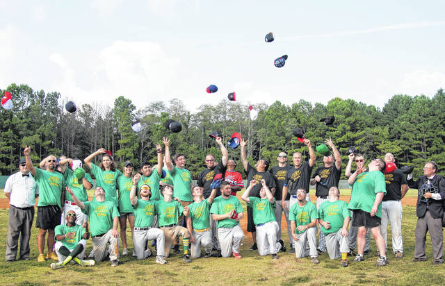 
			
				                                Courtesy photo
                                Players, coaches and umpires toss their hats up in the air after a game. Alternative Baseball provides players with autism and other special needs an opportunity to play the sport independently in an effort to push for inclusion in other areas outside of sports.
 
			
		