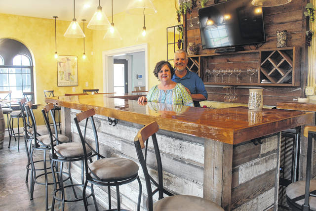 
			
				                                Tomeka Sinclair | The Robesonian
                                Annette Wallwork and her husband, Phillip, stand in the main room of Happenings On Elm, which is set to open in downtown Lumberton in the fall. It will serve as a wine bar and shop, restaurant, art store and event space.
 
			
		