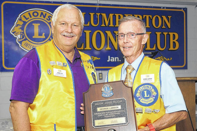 
			
				                                Outgoing Lumberton Lions Club President Sammy Cox, left, presents Lion George Lawson with a plaque in recognition of Lawson being named a Melvin Jones Fellow by the Lumberton Lions Club during the club’s annual awards night on Aug. 20. Becoming a Melvin Jones Fellow is the highest honor bestowed upon a Lions member for their service and dedication to others.
 
			
		