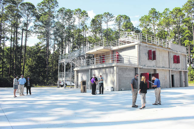 
			
				                                Robeson Community College officials cut the ribbon Monday on a new burn building, a project three years in the making. The structure will be used to simulate fire scenarios to help train law enforcement, emergency services personnel and firefighters.
                                 Tomeka Sinclair | The Robesonian

			
		