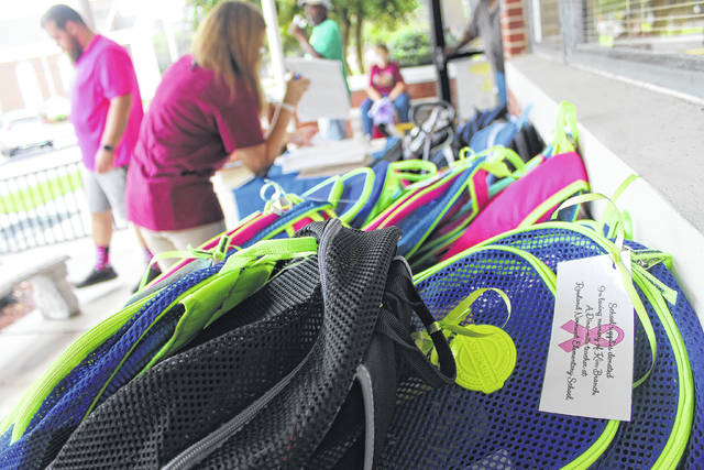 
			
				                                Tomeka Sinclair | The Robesonian
                                More than 90 book bags were donated to the kindergarten class of Rowland Norment Elementary School in memory of Kim Branch, a teacher who died Sept. 3 of breast cancer.
 
			
		