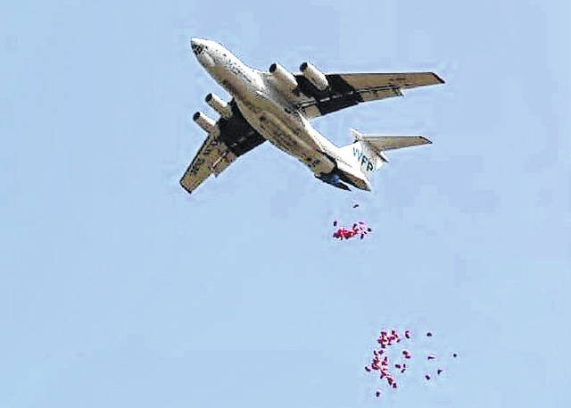 
			
				                                Courtesy photo | U.N. World Food Program
                                Shown is the U.N. World Food Program dropping food in Africa using parachutes designed by Steven Singletary, a chemistry professor at The University of North Carolina at Pembroke. The assistance program won the 2020 Nobel Peace Prize in October.
                                 Courtesy photo | U.N. World Food Program

			
		