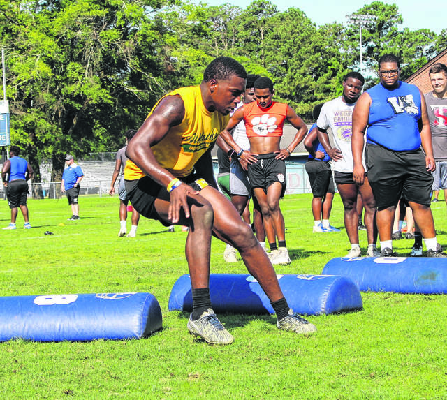 
			
				                                The Robesonian file photo
                                Fairmont’s Kadeem Leonard maneuvers through a drill during Western Carolina University’s recruitment camp at Terry Sanford in June 2019. Leonard will be enrolling early at Central Florida and will not play for Fairmont during the spring football season.
 
			
		