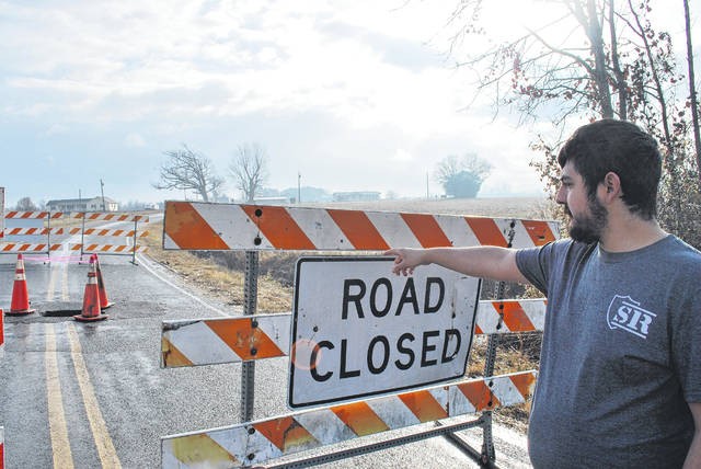 
			
				                                Alan Walters, 26, of Bloomingdale Road in Orrum, points Thursday morning to a hole in the road. A “drainage pipe” failure Wednesday night caused the hole, which is located near Creek and Bloomingdale roads. Bloomingdale Road is closed to traffic in both directions. And the intersection of Barnes and Bloomingdale roads is closed. State Department of Transportation personnel will perform a thorough assessment of the area on Monday, with repairs estimated to be complete by Jan. 8, according to Andrew Barksdale, an NCDOT spokesman.
 
			
		
