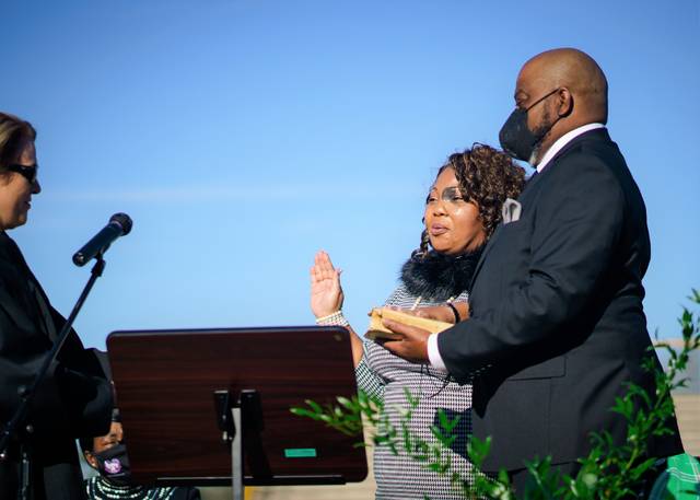 
			
				                                Bryon Patterson | Prolific Visions, LLC
                                Judge Donna Stroud, chief justice of the North Carolina Court of Appeals, swears in Tiffany Powers to Robeson County Superior Court on Sunday during a ceremony at Lumberton High School. Holding the Bible is Power’s husband, Kim Powers. Powers now is the N.C. Superior Court District 16B Seat 1 judge.
 
			
		