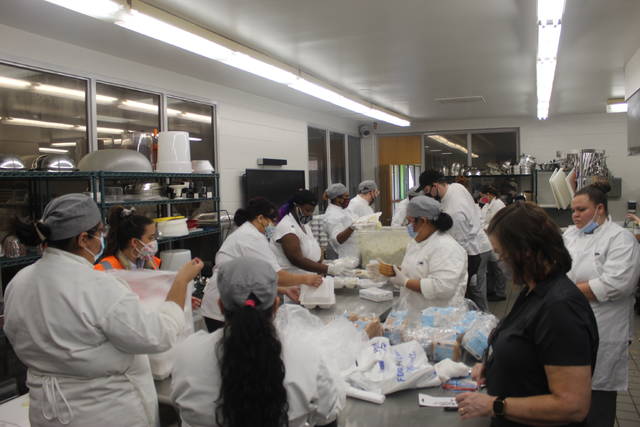 
			
				                                Students from Robeson Community College’s Culinary Arts Department prepared hundreds of plates Thursday during the Battle of the Butts fundraiser. The event benefited RCC programs and Community In Schools of Robeson County.
                                 Photos by Tomeka Sinclair | The Robesonian

			
		