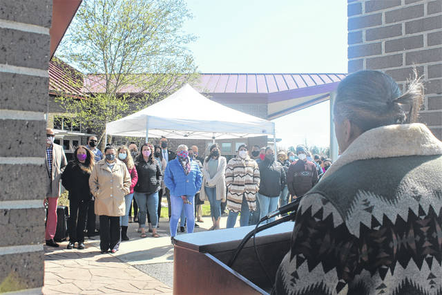 
			
				                                Lumbee Tribal Chairman Harvey Godwin Jr. speaks of giving thanks during a prayer service held outside the Lumbee Tribe Housing Complex on Good Friday. More than 30 people participated in the prayer service led by Lumbee Tribal Council Speaker Ricky Burnett.
 
			
		