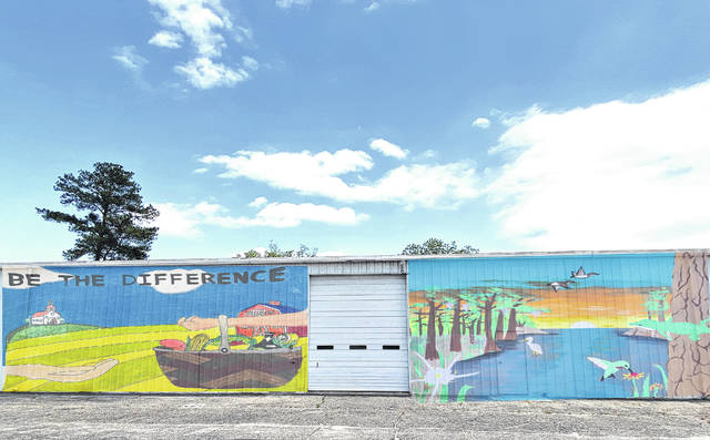 
			
				                                Shown is a rendering of what the artwork of students Maggie Underwood and Arizona Carter will look like when painted on the Robeson County Church and Community Center’s Home Store. Carter and Underwood recently were named winners of the Home Store Mural Contest for their original designs.
                                 Courtesy photo

			
		