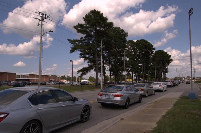 
			
				                                Traffic was backed up Monday on Linkhaw Road as parents lined up to pick up students at the end of their first full day of instruction at Lumberton High School. Monday marked the first day of full in-person instruction for the Public Schools of Robeson County.
                                 Jessica Horne | The Robesonian

			
		