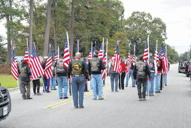
			
				                                Military veterans prepare Tuesday to march ahead of the funeral procession of U.S. Army 1st Lt. James Earl “Dick” Wright who was after 77 years laid to rest in Lumber Bridge.
 
			
		
