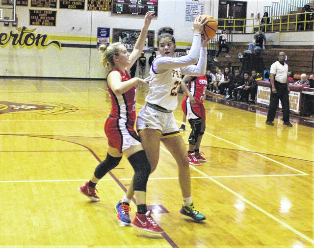 <p>Lumberton’s Sydney Jacobs (23) looks to pass as Seventy-First’s Hannah Lewis (10) defends during Friday’s game in Lumberton.</p>
                                 <p>Chris Stiles | The Robesonian</p>