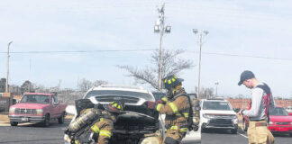 
			
				                                Lumberton firefighters work Thursday morning to assess a vehicle that had caught fire in the parking lot at the Robeson County Sheriff’s Office.
                                 Jessica Horne | The Robesonian

			
		