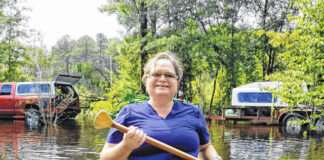 
			
				                                Licensed practical nurse Betty Kinlaw canoes from her home in Lumberton to her vehicle, which was moved to higher ground before Hurricane Florence. It’s been nearly four years since Hurricane Florence devastated Robeson County. A report released by the N.C. Office of the State Auditor found that found that the N.C. Department of Public Safety did not properly ensure Hurricane Florence Disaster Recovery Funds were being spent in accordance with legislative guidelines.
                                 File photo | The Robesonian

			
		
