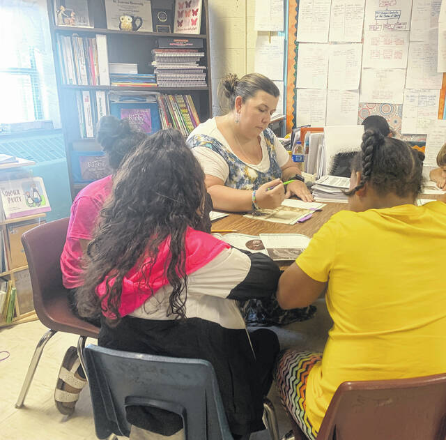 
			
				                                Oxendine Elementary School teacher Shannon McNeill can be seen teaching third-graders how to read proficiently each year. McNeill told The Robesonian she enjoys watching her students mature and observing the impact her work as an educator has on their lives.
 
			
		