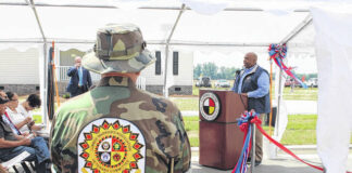 
			
				                                Lt. Gov. Mark Robinson speaks during a Memorial Day ceremony held Thursday by the Lumbee Tribe. Shown from behind is veteran Larry Townsend.
 
			
		