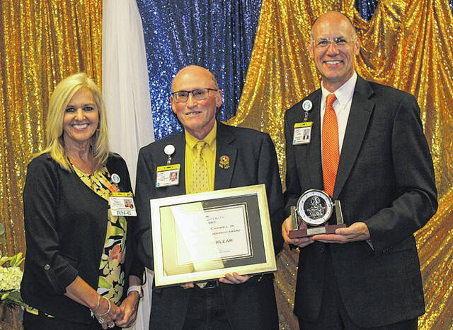 <p>UNC Health Southeastern Vice President and Chief Nurse Executive Renae Taylor, left, and UNC Health Southeastern President/CEO Chris Ellington, far right, present Pharmacy Director Eric Locklear with the 2021 W. Reid Caldwell Jr. Distinguished Leadership Award.</p>
                                 <p>Courtesy photos | UNC Health Southeastern</p>