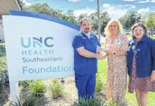 
			
				                                Shenan Thompson, left, is presented a check for winning the Lillian Huggins Fowler Scholarship Award by UNC Health Southeastern Chief Nursing Officer Renae Taylor, center, and UNC Health Southeastern Foundation Executive Director Sissy Grantham.
                                 Courtesy photo | UNC Health Southeastern

			
		