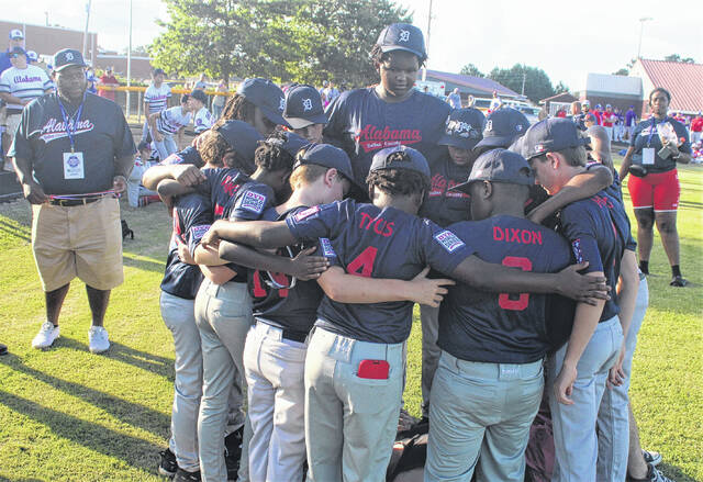 <p>Members of the Alabama majors team huddle before the Dixie Youth World Series opening ceremony Friday at Alton G. Brooks Stadium in Lumberton.</p>
                                 <p>Chris Stiles | The Robesonian</p>