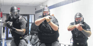 
			
				                                Sgt. Reginald Roberts, left, Deputy Michael Ellis, and Sgt. Cobey Houser, are trailed by 1st Sgt. Stevie Thompson, completing a four-man movement in an active shooter training scenario. The law enforcement officers along with about 16 other Robeson County Sheriff’s Office Deputies and School Resource Officers participated in the training held at the former Green Grove Elementary School.
 
			
		