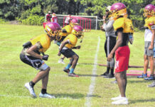 
			
				                                Lumberton’s defensive secondary runs drills as assistant coach Quintan Pate looks on during practice Monday in Lumberton.
                                 Chris Stiles | The Robesonian

			
		