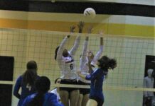 
			
				                                Fairmont’s Stalaisa Chavis (6) and another Kensley Newberry (0) attempt to block a spike by St. Pauls’ Katherin Lowery (2) during Tuesday’s match in Fairmont.
                                 Chris Stiles | The Robesonian

			
		