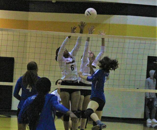 
			
				                                Fairmont’s Stalaisa Chavis (6) and another Kensley Newberry (0) attempt to block a spike by St. Pauls’ Katherin Lowery (2) during Tuesday’s match in Fairmont.
                                 Chris Stiles | The Robesonian

			
		
