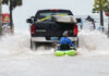 
			
				                                A truck pulls a man on a kayak on a low-lying road after flooding in the aftermath of Hurricane Ian, in Key West, Fla., Wednesday.
                                 Mary Martin | AP

			
		
