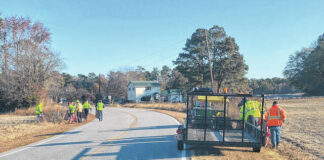 
			
				                                A waste collection crew works in Robeson County, where trash thrown from vehicles has become unsightly.
                                 Photo courtesy Robeson County Solid Waste

			
		