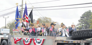 
			
				                                The Veterans of Foreign Wars Post 2843 wave to the crowd during the Veterans Day Parade held in Pembroke last year. Another parade is scheduled for Friday.
 
			
		