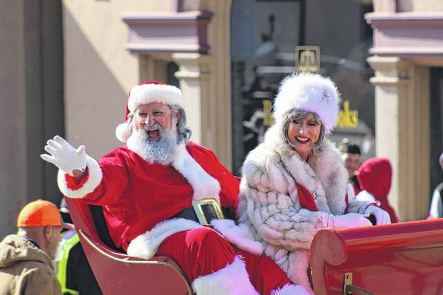 
			
				                                Santa and Mrs. Claus took some time away from preparing for the Christmas season to take part in the Lumberton Christmas Parade held on Saturday.
                                 Tomeka Sinclair | The Robesonian

			
		