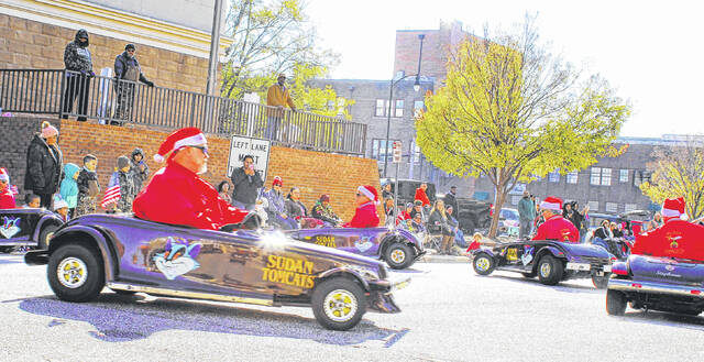 <p>Crowds at the 2022 Lumberton Christmas Parade moved out of the way for Sudan Shriners who performed the go-cart tricks.</p>