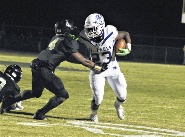 
			
				                                St. Pauls’ Kemarion Baldwin (23) stiffarms Clinton’s Josiah Robinson (4) during an Oct. 14 game at Clinton. Baldwin has been named The Robesonian’s Robeson County Heisman for the third time.
                                 Chris Stiles | The Robesonian

			
		