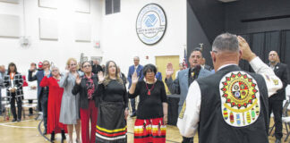 
			
				                                Gerald Goolsby, District 2; Pam Hunt, District 3; Kristie Revels Hunt, District 6; Yvonne Dial, District 7; Kathy Oxendine Hunt, District 8; Jo Chavis Doss, District 12; and Albert Baker, District 13 are administered the Oath of Office onto Lumbee Tribal Council during am inauguration ceremony held Thursday.
 
			
		