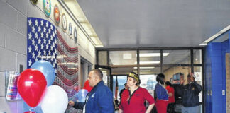 
			
				                                The Robeson Community College Foundation unveils its Veteran’s Wall of Honor Friday during a ceremony. The wall features all six branches of government – the United States Army, United States Marine Corps, United States Navy, United States Air Force, United States Coast Guard, and the United States Space Force.
 
			
		