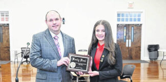 
			
				                                Drew Davis, Director of Curriculum and Instruction at PSRC, left stands recently with 2023-2024 North Carolina Junior Beta State President-Elect Keely Deal during a plaque presentation at the February PSRC Board of Education meeting. Deal seeks to be a positive role model for her peers and a friend who encourages all students to see themselves as valuable.
                                 Courtesy photo | Public Schools of Robeson County

			
		
