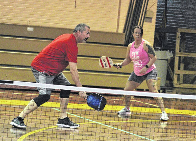 <p>Bruce Mullis, left, and Leigh Carter, right, wait for the ball during a recent pickleball game at Bill Sapp Recreation Center in Lumberton.</p>
                                 <p>Chris Stiles | The Robesonian</p>