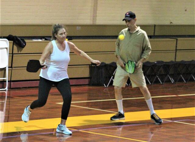 <p>Melinda Cook-Brayboy, left, and Josiah Boone, right, wait for the ball during a recent pickleball game at Bill Sapp Recreation Center in Lumberton.</p>
                                 <p>Chris Stiles | The Robesonian</p>