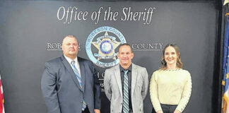 
			
				                                Newly sworn-in Robeson County Sheriff’s Office deputies Quinten Mauney, Ryan Stone, and Clairey Pettis.
 
			
		