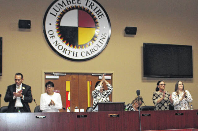<p>Lumbee Tribal Council members stood and applauded after voting for a resolution of support for cultural identity affirmation.</p>
                                 <p>Tomeka Sinclair | The Robesonian</p>