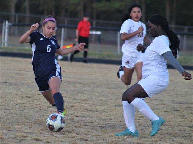 
			
				                                Purnell Swett’s Josie McLean (6) runs with the ball past Lumberton’s Keashia Bethea, right, during Saturday’s Robeson Cup championship match in Pembroke. McLean, who had four goals in the tournament, was named tournament MVP.
                                 Chris Stiles | The Robesonian

			
		
