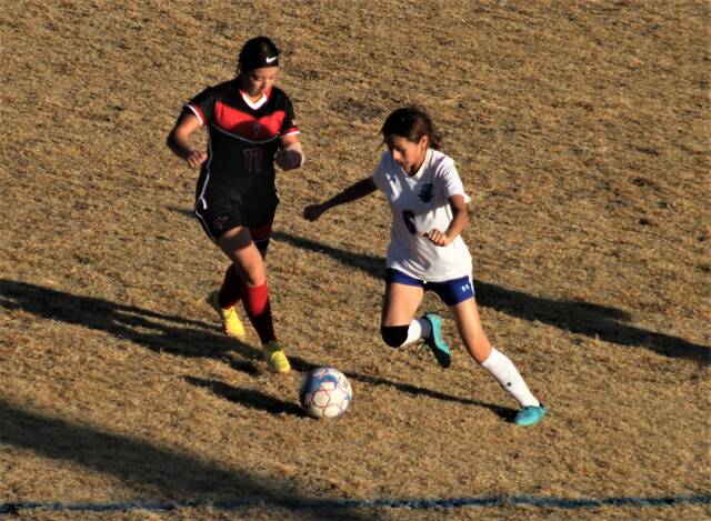 <p>Red Springs’ Suany Acosta Hernandez (17) and St. Pauls’ Jaquelyn Castillo (6) battle for possession during Saturday’s Robeson Cup third-place match in Pembroke.</p>
                                 <p>Chris Stiles | The Robesonian</p>