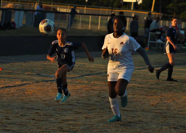 <p>Purnell Swett’s Aonor Woodell (10) and Lumberton’s Keashia Bethea (16) chase after the ball during Saturday’s Robeson Cup championship match in Pembroke.</p>
                                 <p>Chris Stiles | The Robesonian</p>