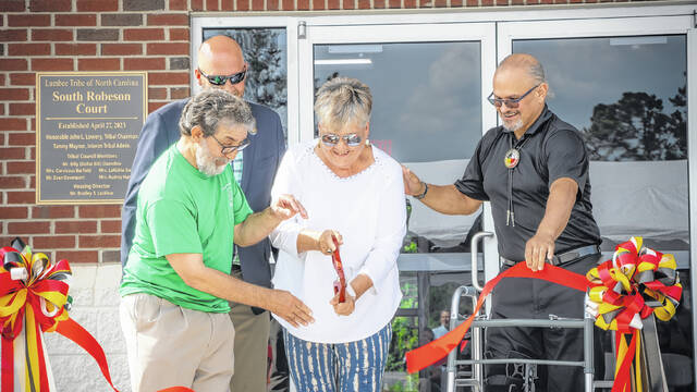 
			
				                                Former Lumbee Tribal Council Members Carvicous Barfield and Evan Davenport recently joined District 1 Councilman Billy “Dollar Bill” Oxendine and Lumbee Tribal Chairman John L. Lowery to cut the ribbon to the new South Robeson Court Administrative Building in Rowland. The project is among several announced by Lowery during the Lumbee Tribal Council business meeting.
                                 Courtesy photo | Lumbee Tribe of N.C.

			
		