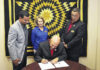 Lumbee Tribal Chairman John Lowery signs documents to amend the Lumbee Tribe Homeownership Policy with Housing Director Bradley Locklear, Financial Edu/Housing Manager Kathy Locklear and Tribal Administrator Ricky Harris. Photo courtesy Lumbee Tribe