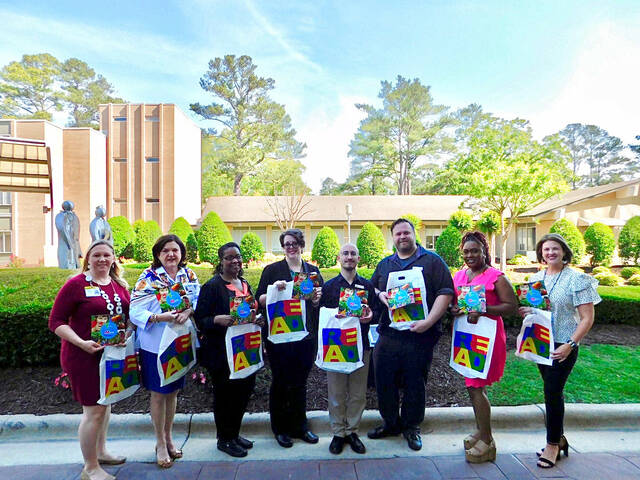A grant from the State Library of North Carolina has helped foster a strong partnership with UNC Health Southeastern and the Robeson County Public Library. Pictured left to right are Renee Collins, Sissy Grantham, Anita Thurman, Katie Fountain, Patrick Parker, Hugh Alderson, Asia Carter, Caroline Lloyd. Courtesy RCPL