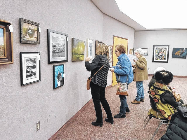 <p>People at the Osterneck Auditorium</p>
                                 <p>Courtesy of Robeson Art Guild</p>